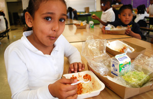 Nikka, a school girl, at lunch